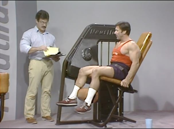 Mike Mentzer writing down results with Boyer Coe