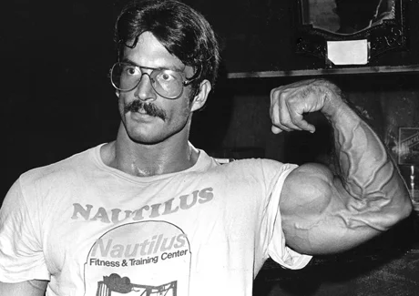 Mike Mentzer flexing his 20 inch bicep